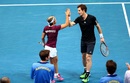 Andy Murray and Kirsten Flipkens celebrate match point against Serena Williams and Lleyton Hewitt