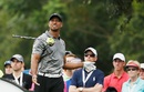 Tiger Woods watches his errant tee shot