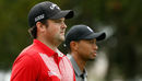 Patrick Reed and Tiger Woods stroll down the fairway