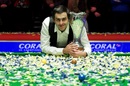 Ronnie O'Sullivan smiles with the UK Championship trophy