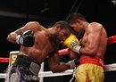 Lamont Peterson punches Amir Khan