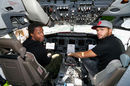 Gael Monfils and Jo-Wilfried Tsonga pose in the cockpit of a plane