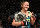 Carla Esparza celebrates her submission victory over Rose Namajunas in the third round which saw her become the first UFC women's strawwieght champion