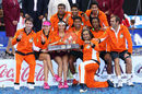 The Indian Aces pose for a group shot with the trophy after becoming winners of the first IPTL Tour