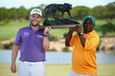 Branden Grace needed an extra pair of hands to help lift the Alfred Dunhill Championship trophy
