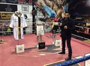Amir Khan poses with his clothing from his Las Vegas fight against Devon Alexander that will be auctioned off