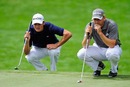 Martin Kaymer and Sergio Garcia line up their putts