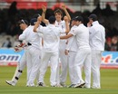 Steve Finn is congratulated by his England teammates after taking a couple of quick wickets against Bangladesh