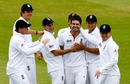 James Anderson is congratulated after taking another wicket for England