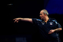 Phil Taylor eased into the last 16 at Alexandra Palace