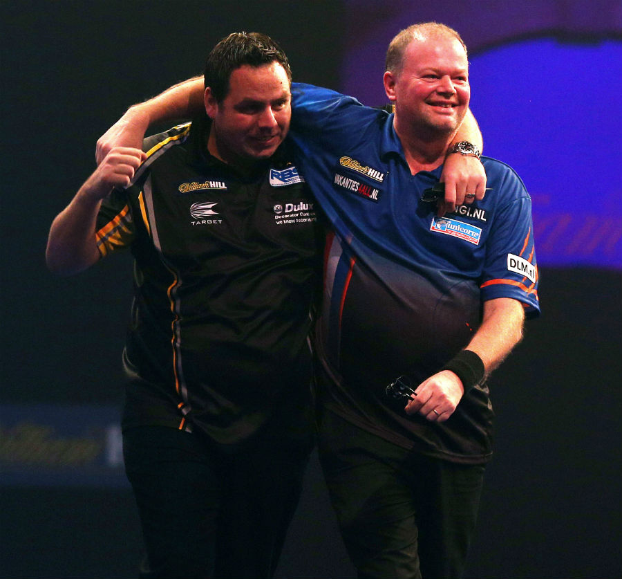 Adrian Lewis and Raymond van Barneveld embrace after their epic encounter at the PDC World Championship