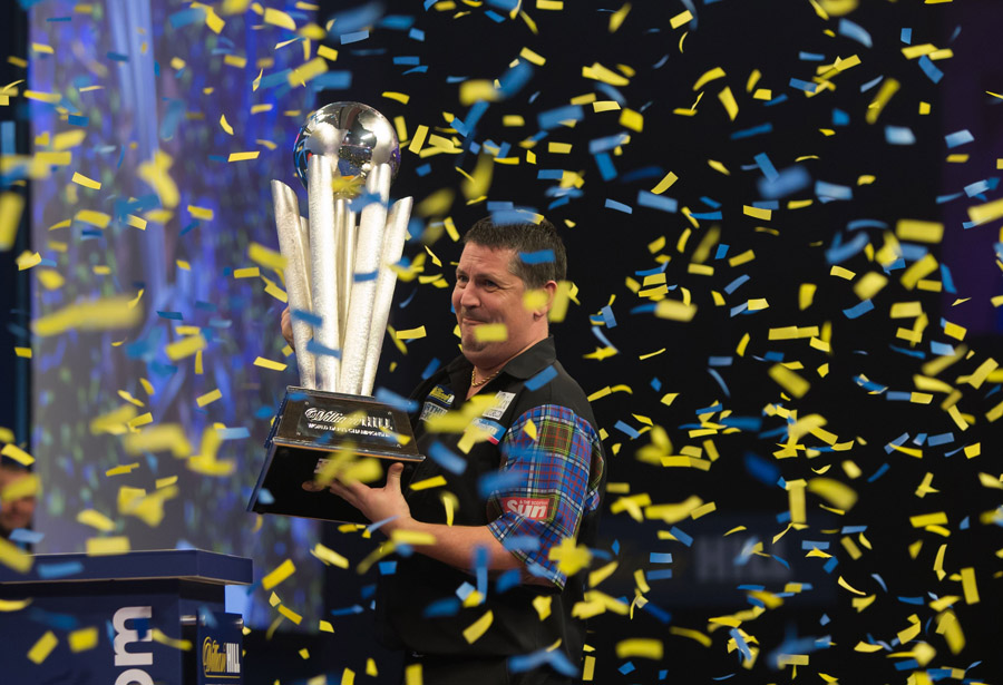 Gary Anderson holds back tears as he lifts the Sid Waddell trophy
