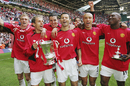 Darren Fletcher, Phil Neville, John O'Shea, Ryan Giggs, Ruud van Nistelrooy, Mikael Silvestre and Eric Djemba-Djemba celebrate with the FA Cup