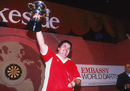Phil Taylor lifts the trophy after winning the World Professional Darts Championship