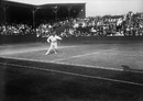 Norman Brookes in action against A E Beamish at Wimbledon