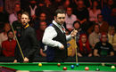 Stephen Maguire survived a late comeback from Judd Trump at the Masters