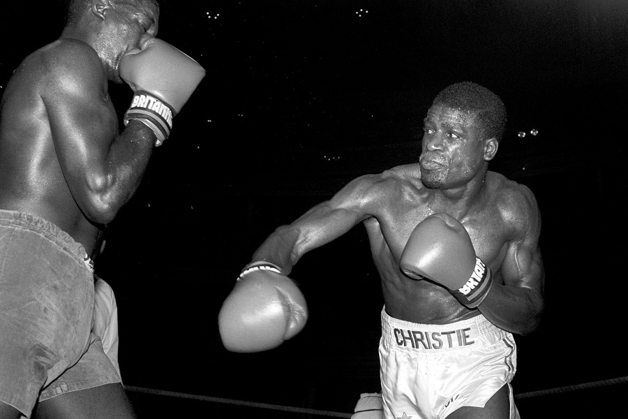 Errol Christie lands a punch on Winston Burnett