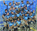 Bulls players celebrate with the trophy after winning the Super 14 final