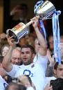 England's Nick Easter lifts the silverware following their victory against the Barbarians