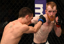 Paddy Holohan punches Shane Howell in their flyweight fight