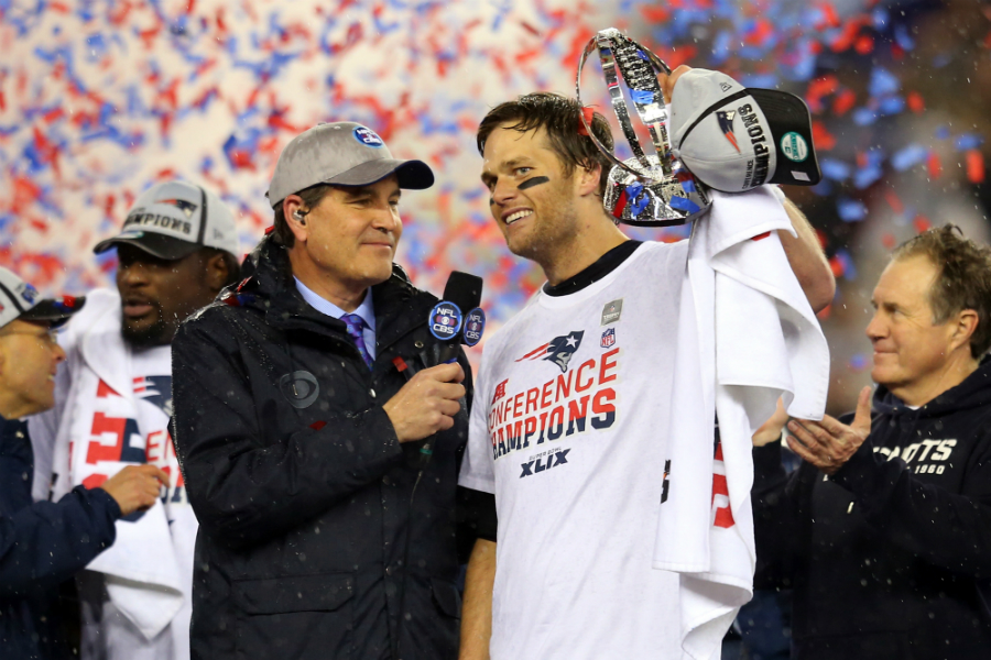 Tom Brady holds up the trophy after the New England Patriots defeat the Indianapolis Colts in the AFC Championship Game