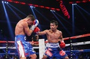 Manny Pacquiao lands a punch on Chris Algieri
