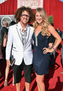 Singer Stefan 'Redfoo' Gordy and tennis star Victoria Azarenka pose on the red carpet at the 2013 ESPY Awards