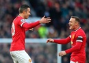 Robin van Persie, left, and Wayne Rooney celebrate during their 3-1 win over Leicester City