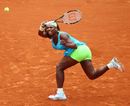 Serena Williams arcs her back to play a forehand