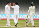 Tim Bresnan and Graeme Swann celebrate a wicket