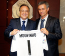 Jose Mourinho poses next to Real Madrid president Florentino Perez