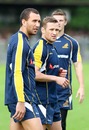 Australia's Quade Cooper and Matt Giteau look on during training 