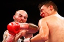 Kevin Mitchell lands a punch on Daniel Estrada during their WBC Silver Lightweight Title fight