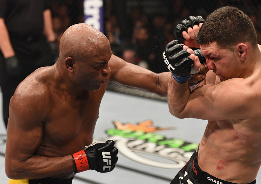 Anderson Silva punches Nick Diaz in their middleweight bout