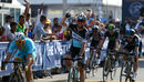 Mark Cavendish celebrates after winning the first stage of the Dubai Tour
