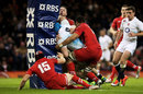 James Haskell batters into the post as the Wales defence scrambles to cover