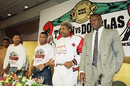 Mike Tyson, left, challenger Buster Douglas, right, and promoter Don King pose for photographers