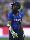 A dejected Moeen Ali walks back after being dismissed by Mitchell Starc