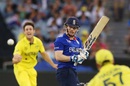 Eoin Morgan looks back to see Brad Haddin about to pouch his edge