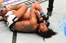 Benson Henderson attempts to submit Brandon Thatch with a rear-naked choke