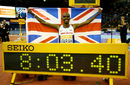 Mo Farah holds up the Union Jack in front of his world-record time