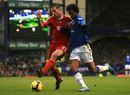 Jo tussles for possession with Jamie Carragher