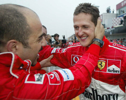 Michael Schumacher celebrates a win for Ferrari
