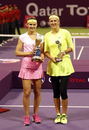 Lucie Safarova poses with Victoria Azarenka after winning the Qatar Open