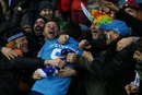 Italy's scrum half Edoardo Gori celebrates with fans after their win over Scotland