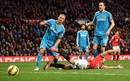 Radamel Falcao clashes with Wes Brown and John O'Shea