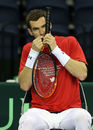 Andy Murray chews on his grip