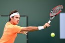 Roger Federer hits a backhand to Diego Schwartzman