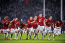 Manchester United players celebrate the moment they win the penalty shoot-out