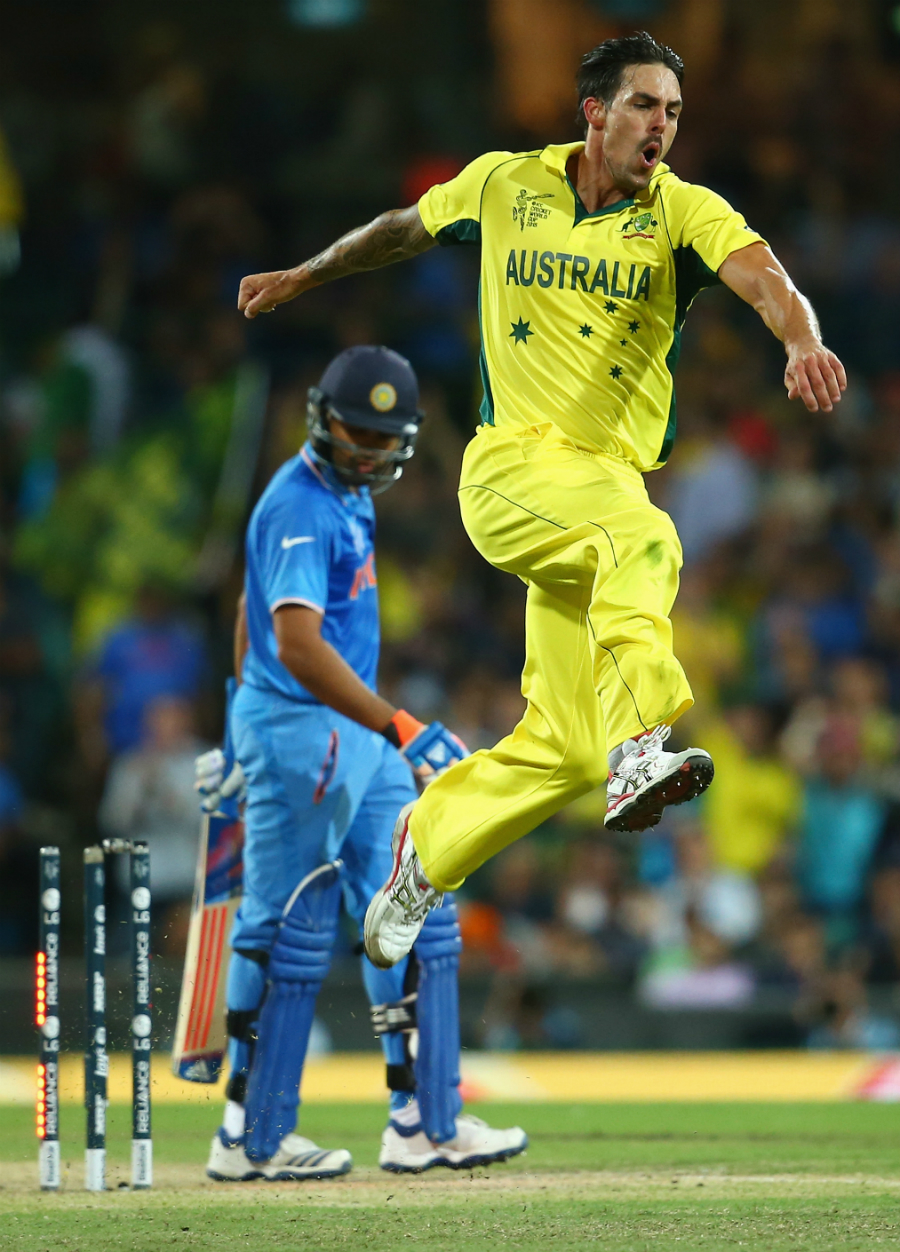 Mitchell Johnson celebrates taking the wicket of Rohit Sharma